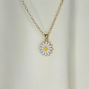 Faux gold necklace with a white flower charm!